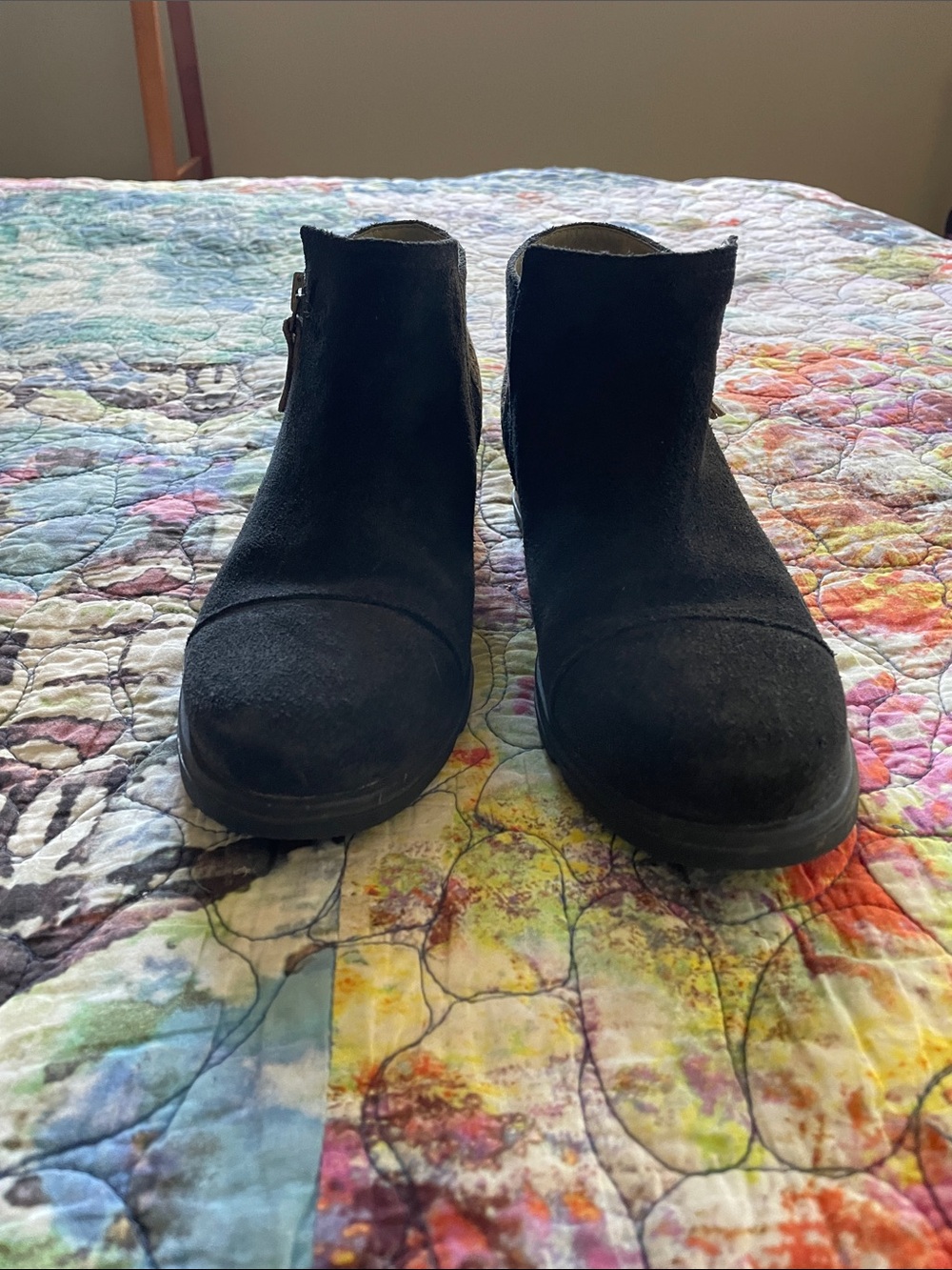 Sorel black suede booties with calf skin spotted print on back